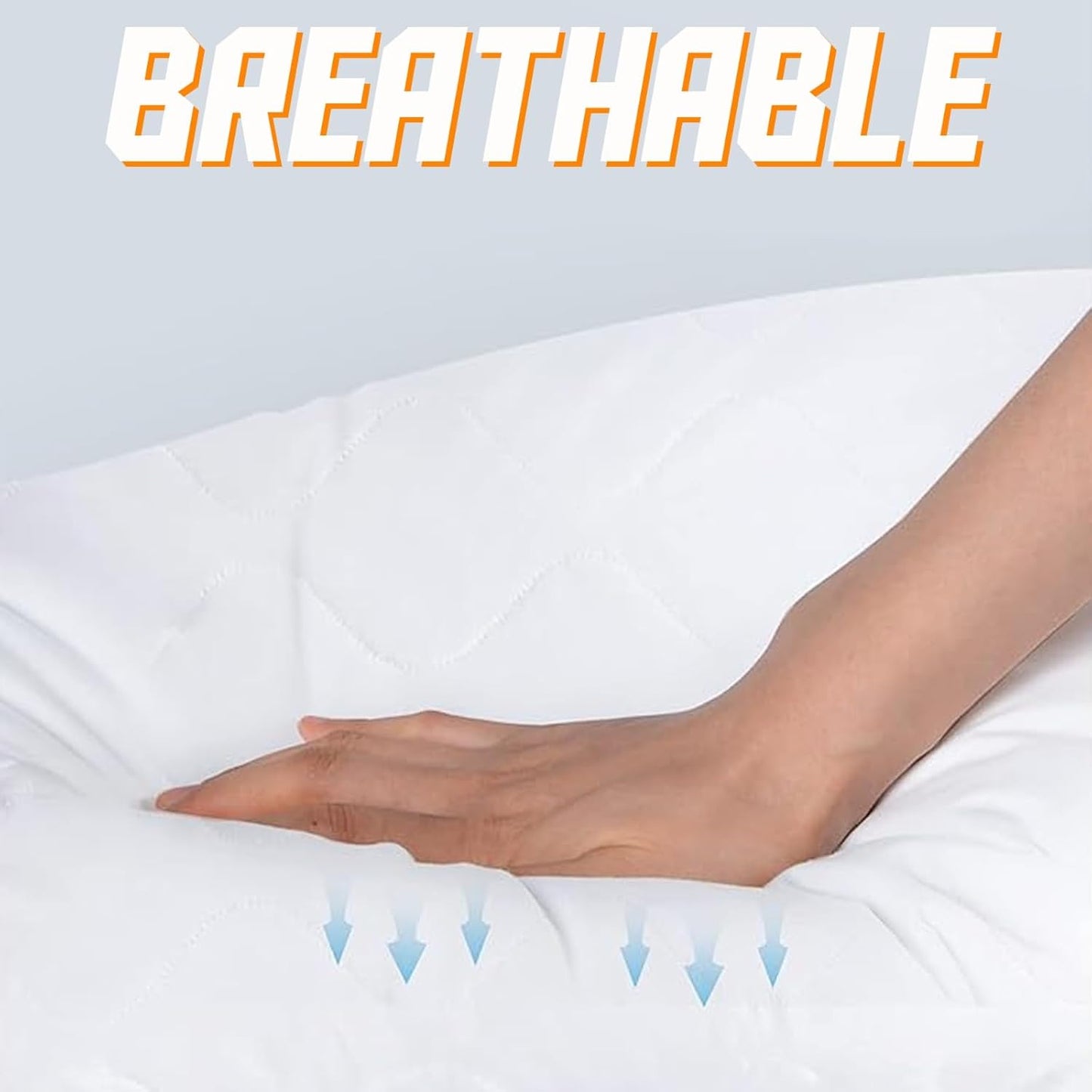 Hand resting on a breathable mattress pad with text indicating breathability.