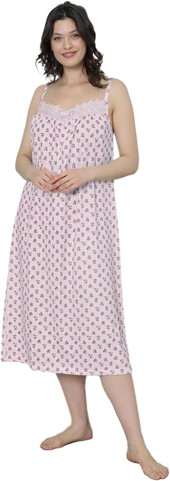 Woman wearing a pink floral nightgown on a white background