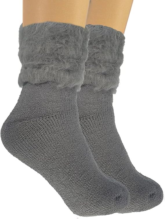 Gray knitted socks with textured cuffs on a white background