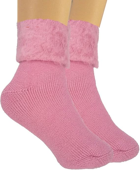 Pink socks with fuzzy cuff on a mannequin foot against a white background