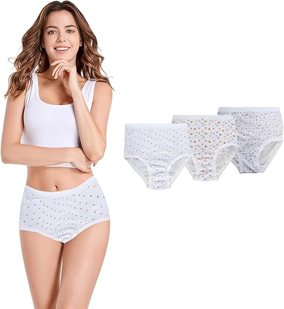 Woman wearing a white tank top and briefs with six pairs of white underwear on a white background