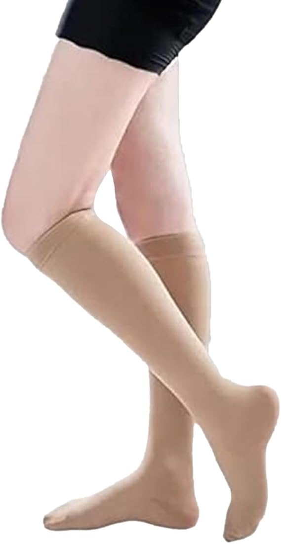 Beige knee-high socks worn by a person on a white background