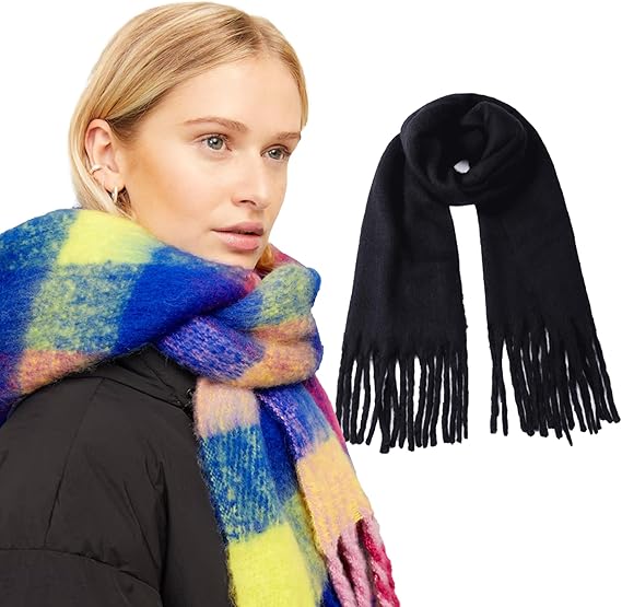 Woman wearing a colorful scarf with a black scarf on a white background