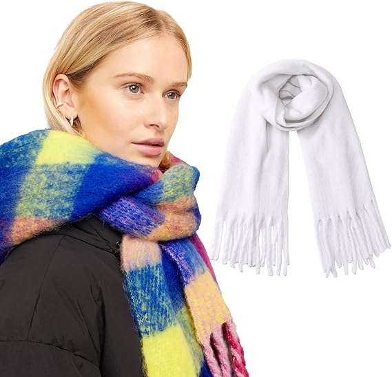 Woman wearing a colorful scarf with a white scarf with fringes on a white background