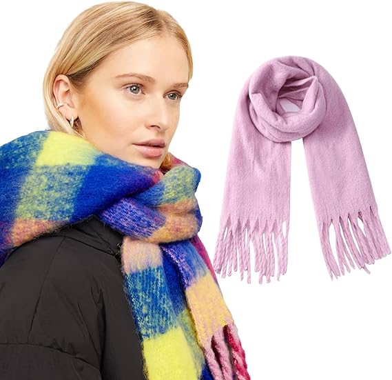 Woman wearing a colorful scarf with a pink scarf on a white background