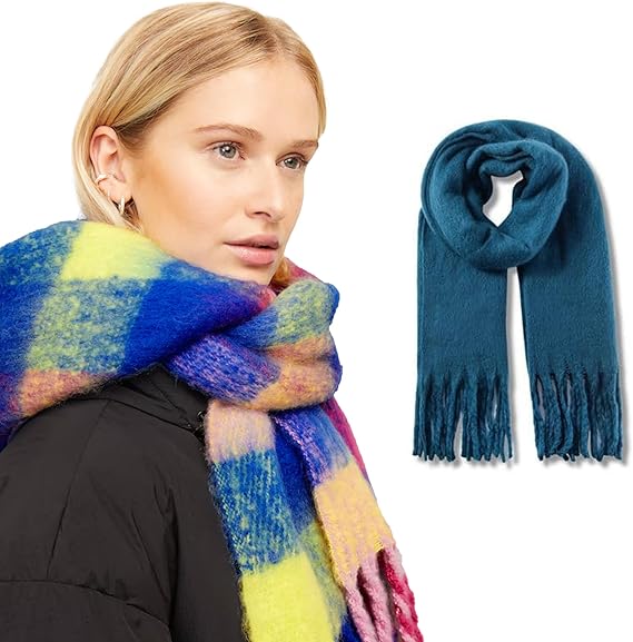 Woman wearing a colorful scarf with a close-up of a blue scarf with fringes on a white background.