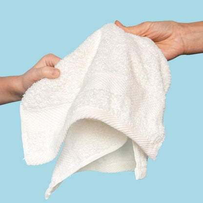 Cotton Hand Towel Being Stretched By Two Hands with Sky Blue Background.