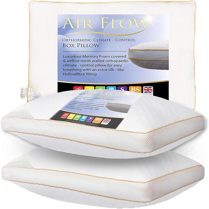 White pillow with gold accents on a white background, featuring packaging labeled 'Air Flow'.
