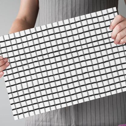 A women holding a terry tea cotton towel which is highly obsorbent 