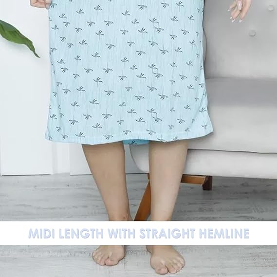 Light blue dress with a subtle pattern worn by a person, sitting on a gray couch.