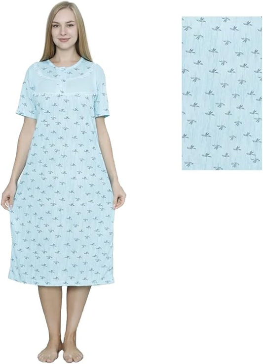 Woman wearing a light blue nightgown with a subtle pattern, standing next to a folded fabric swatch.