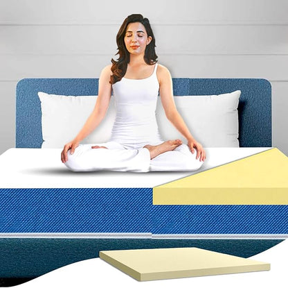 Woman sitting on a bed with a mattress and foam layer shown below