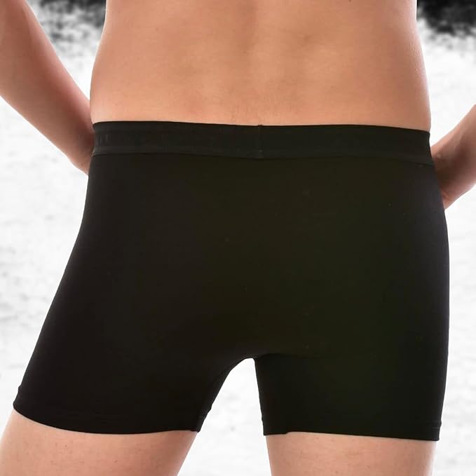 Black boxer briefs worn by a person on a neutral background