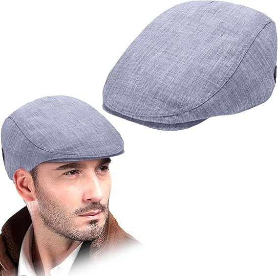 Two blue flat hats caps with a man wearing one of them on a white background