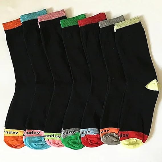 Set of black socks with multicolored tops on a white background