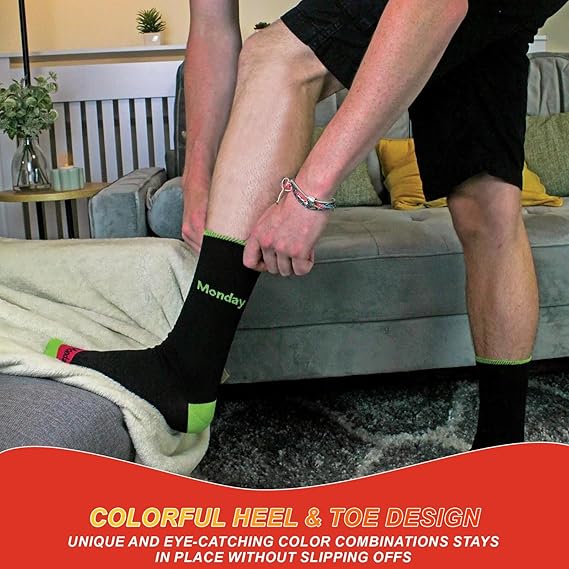 Person wearing a black sock with colorful heel and toe design in a living room setting.
