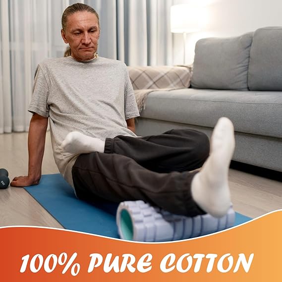 Man exercising on a blue mat with text '100% Pure Cotton' in a living room setting.