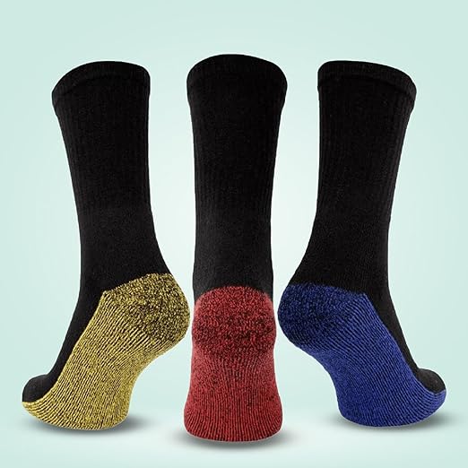 Three pairs of socks with different colored toes on a light blue background