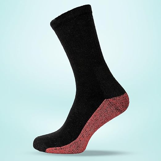 Black sock with a red sole on a light blue background