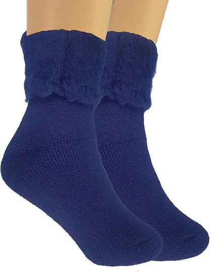 Pair of blue socks with fuzzy cuffs on a white background