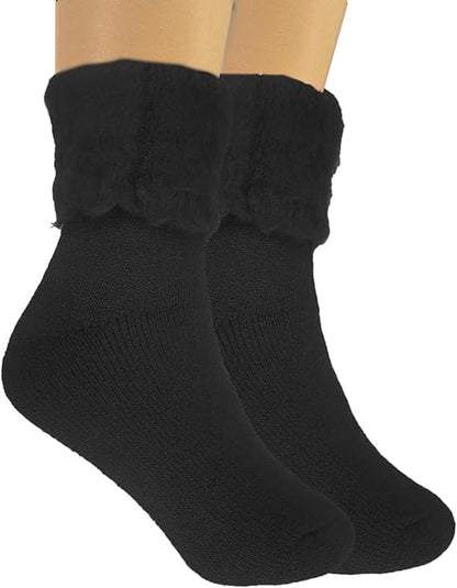 Black socks with fluffy cuffs on a white background