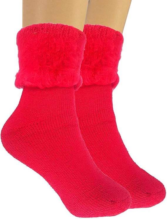 Red socks with fuzzy cuffs on a white background