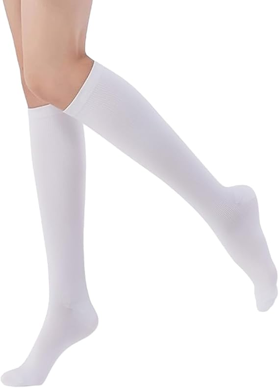 White knee-high socks worn by a person on a white background