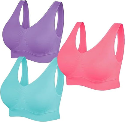 Three sports bras in purple, pink, and teal on a white background