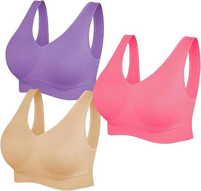 Three sports bras in purple, pink, and beige on a white background